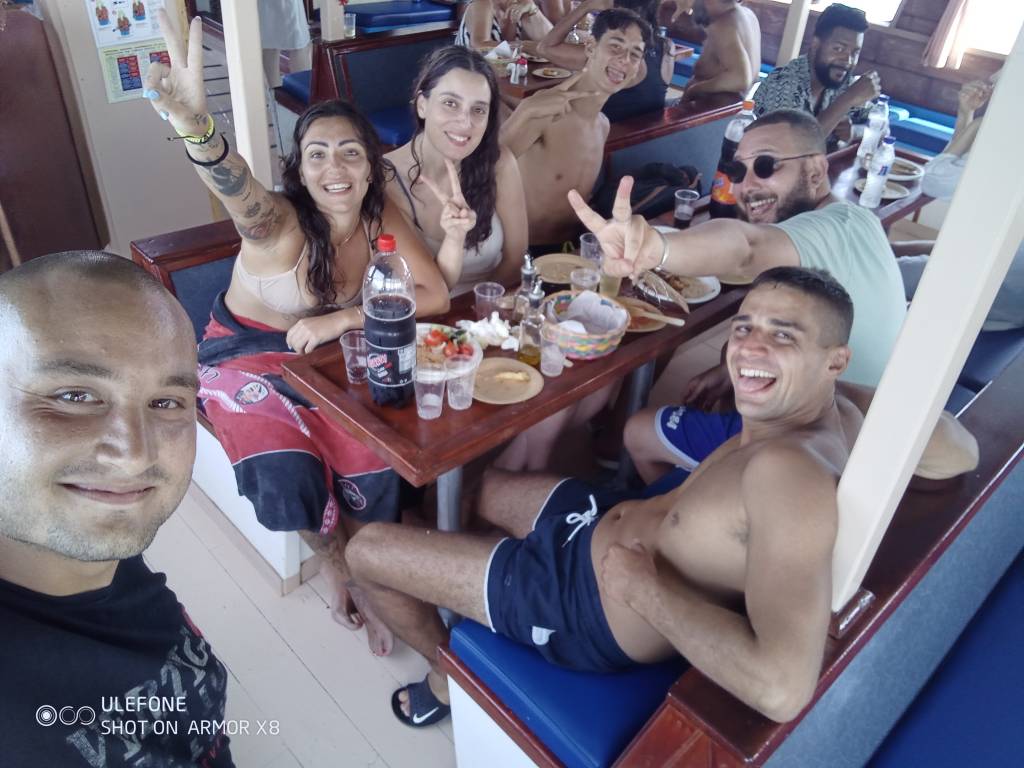 Happy group enjoying food and fun on a boat trip
